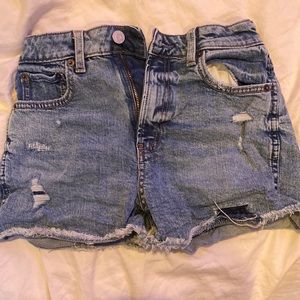 These size 14 high rise short jeans are from GAP. They are a medium wash.